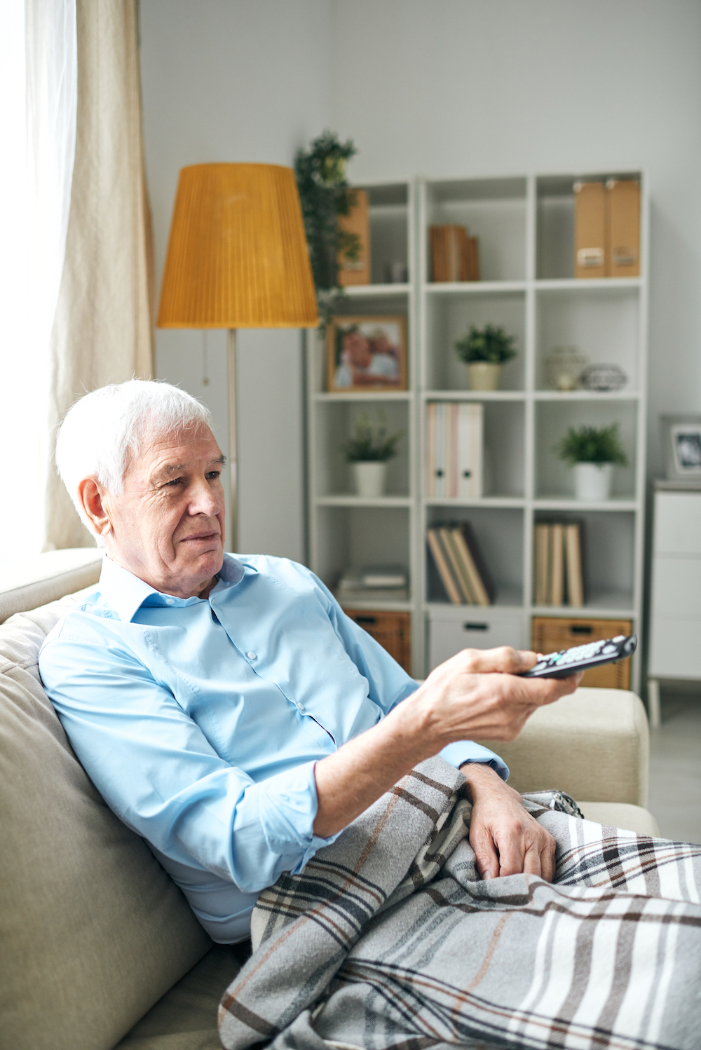 elderly man watching tv